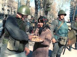 Girl brings food to troops during coup