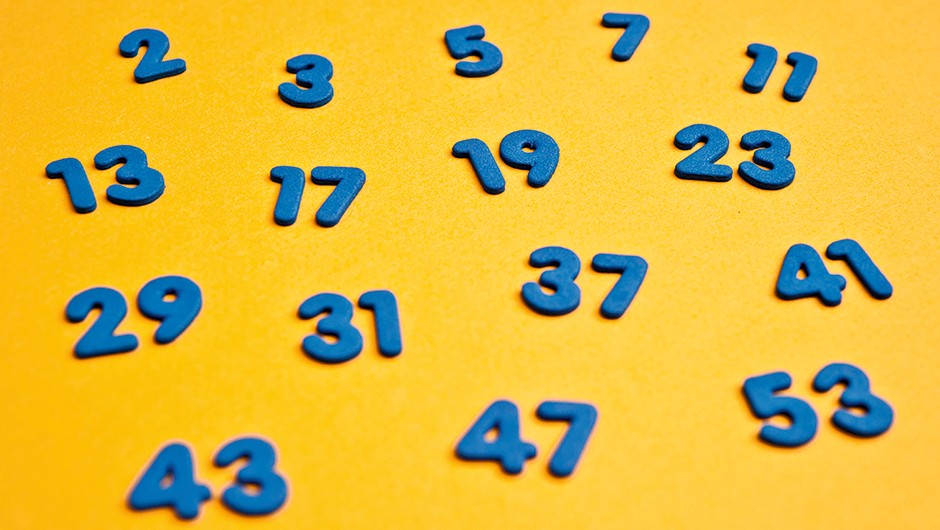 first sixteen prime numbers, blue on yellow